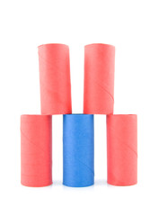 tower of empty toilet paper rolls over white background