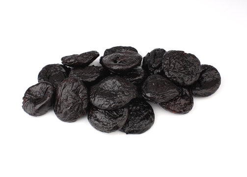 Prunes on a white background.
