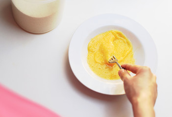 Housewife prepare egg in a plate