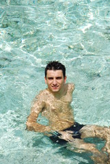 Young man relaxing and smiling in Maldives