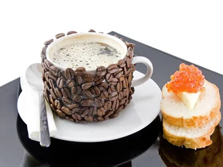Photo sur Plexiglas Bar a café The coffee cup , red caviar on black plate.
