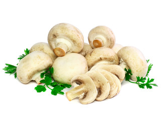 Ripe mushroom champignon with green parsley.Isolated