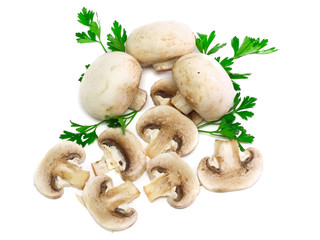 Ripe mushroom champignon with green parsley.Isolated