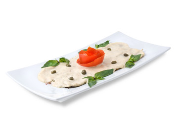 slices of ham with sauce on the plate isolated on white