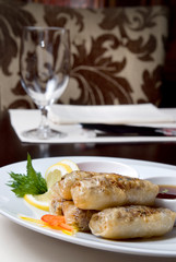 chinese rolls with meat on the plate