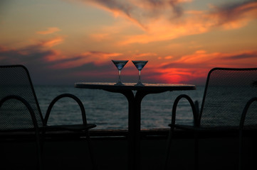 Table with goblets on background of the sundown