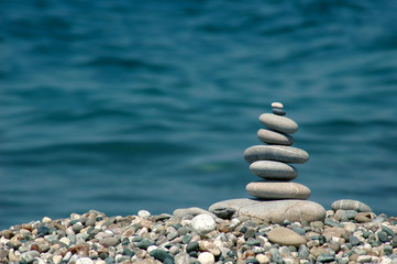 Background with pyramid from sea stones