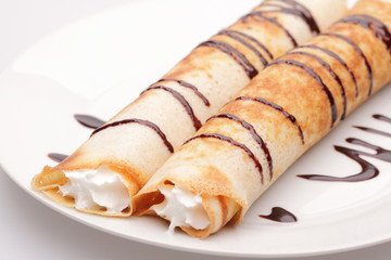 Pancakes with stuffing and chocolate syrup (with shadow)