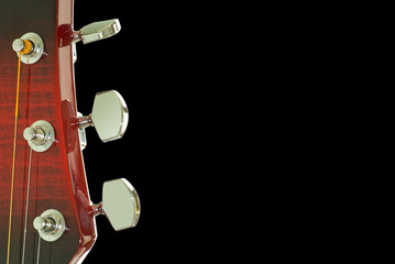 Guitar head. Close up.  Isolated on black  with clipping path.