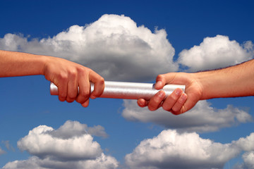 hands passing the baton