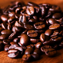 Coffee beans on wooden background