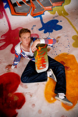 Boy skateboard, graffiti wall