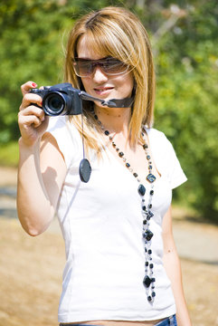 beautiful young woman with camera