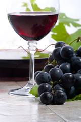 Red wine and grapes