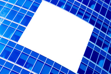 blue abstract crop of modern skyscraper with white placard