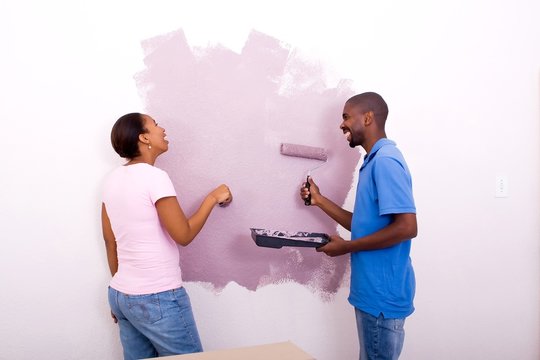 laughing couple painting