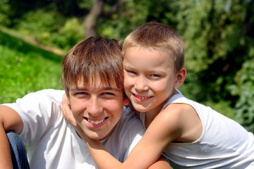 Fototapeta premium happy teenager and kid portrait outdoor