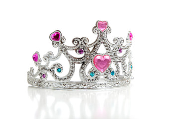 A child's toy princess tiara on a white background