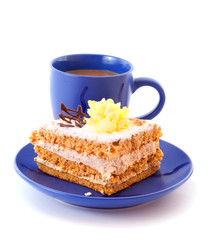 Cake and cup isolated on white