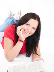 smiling brunette woman studying