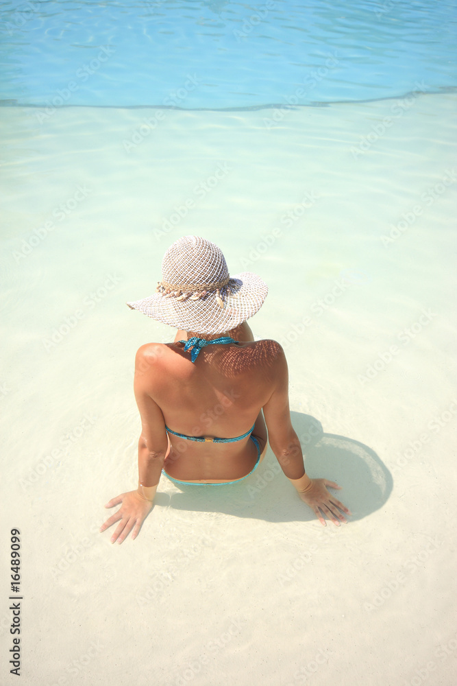 Wall mural tanned blond woman in bikini in the sea