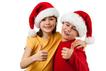 Kids wearing Santa Claus hats showing OK sign , isolated