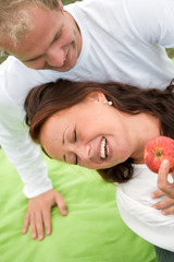 Obraz na płótnie Canvas Romantic couple having fun on picnic