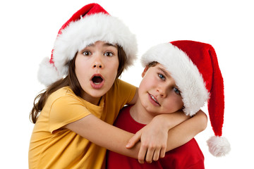 Kids wearing Santa Claus hats  isolated on white