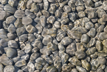 Natural stone pebbles in water