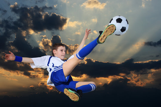 soccer player against the backdrop of cloudy skies
