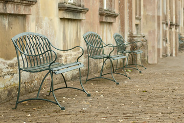 metal seating in a cobbled courtyard