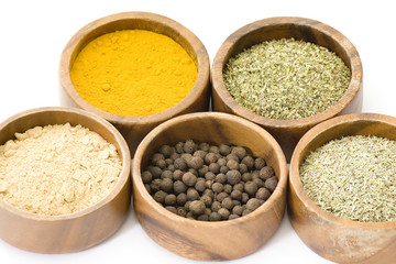 five bowl of spices isolated on white