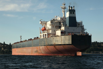 Big freight ship docked in ocean harbor