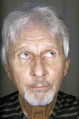 Old man looking to the ceiling