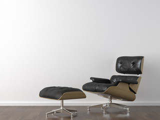 Fototapeta na wymiar black leather armchair on white wall