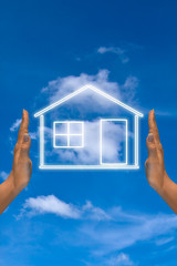 The house among two human hands