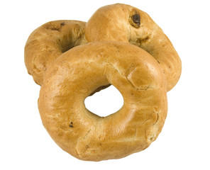 three cinnamon and raisin bagels isolated on white background