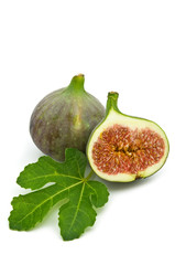 fresh figs and leaf on white background