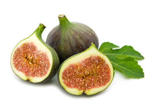 fresh figs and leaf on white background