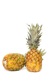 Tasty,fresh pineapples on a white.