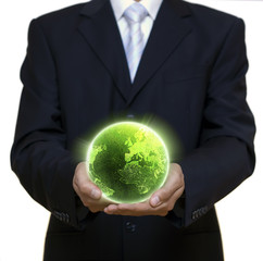 Businessman holding green planet full of lights