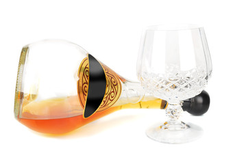 Down brandy bottle and glass drink