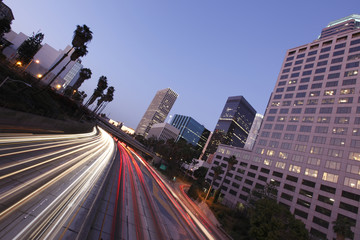 Los Angeles city skyline and freeway after sunset