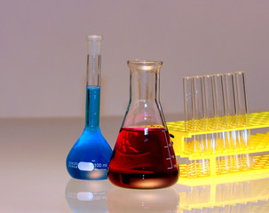 red conical flask and test tubes in research laboratory