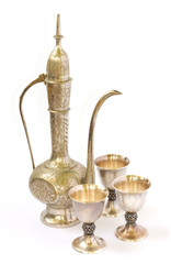 East tableware, jug with wine glasses over white