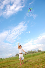 Fototapeta premium girl playing with a kite