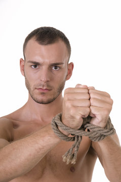Studio shoot of young caucasian man with tied hands