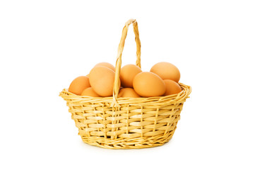 Basket full of eggs isolated on white