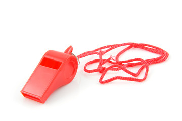 red colored plastic whistle isolated on white background