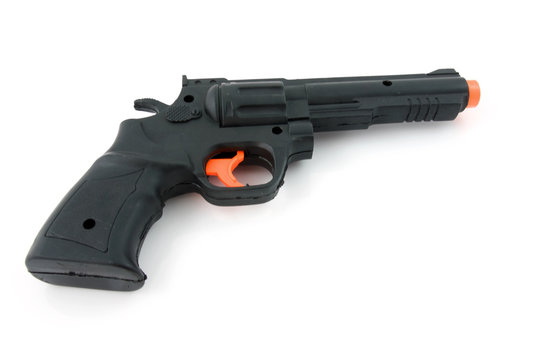 plastic black play gun over white background